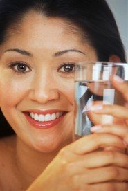 young lady with glass of water