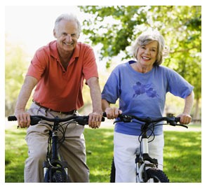 two elderly adults on bikes