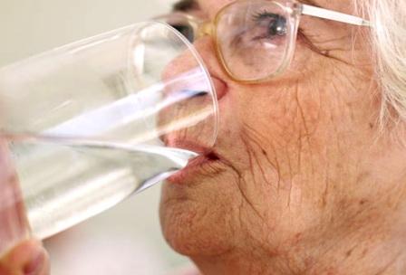 elderly lady drinking water