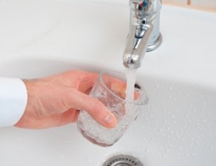 gathering water from a faucet